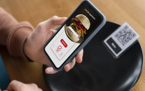 Guest viewing burger menu on phone over QR code