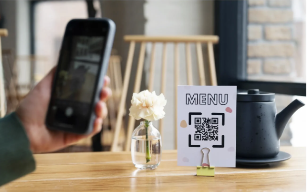 Guest scanning QR code menu on phone with stylish menu card