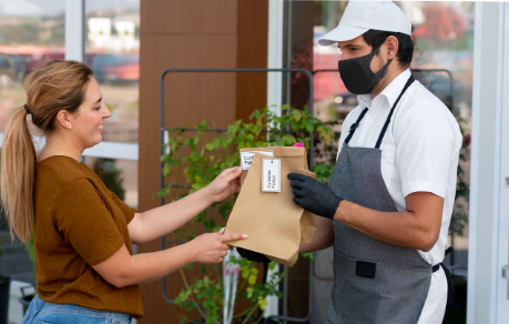 Customer receiving pizza takeout - CaPOS